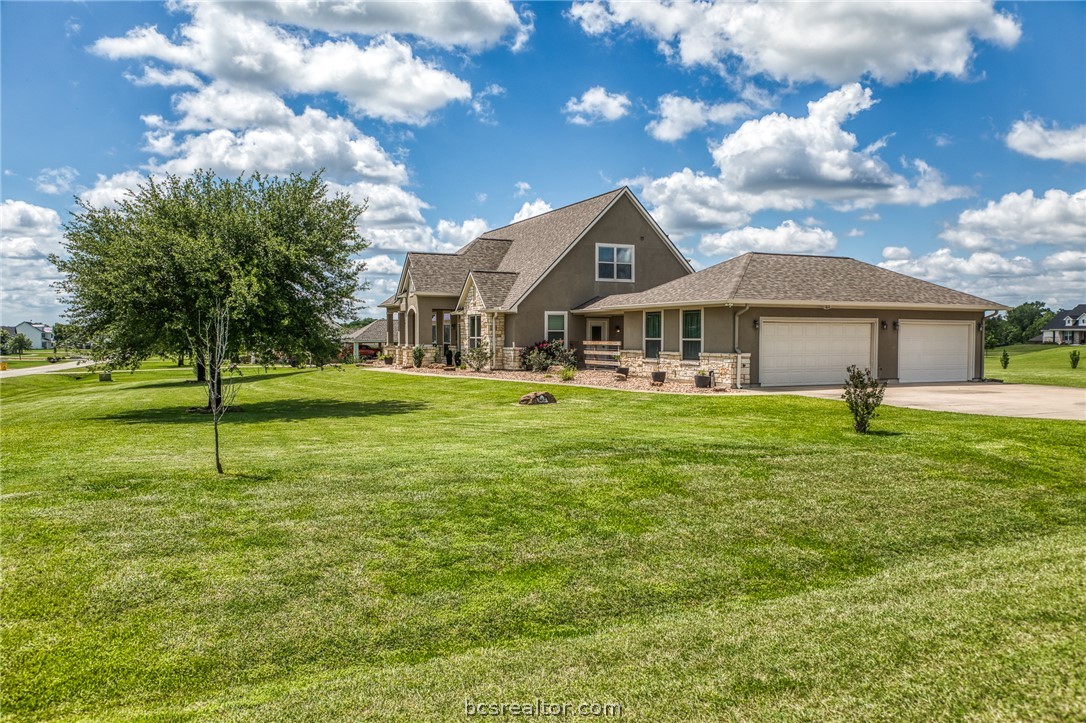 586 Ruby Drive Bellville, TX 77418 - Photo 41 of 50 a front view of a house with a yard