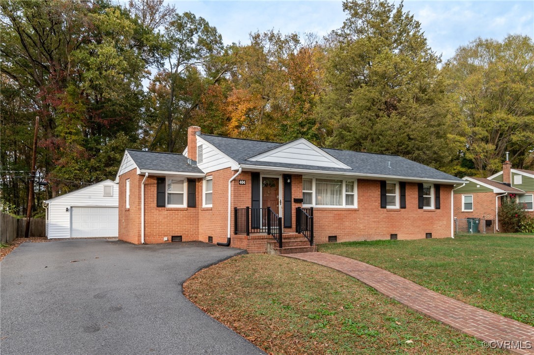 404 East Huntsman Road Sandston, VA 23150 - Photo 4 of 25 Large paved driveway and custom brick sidewalk