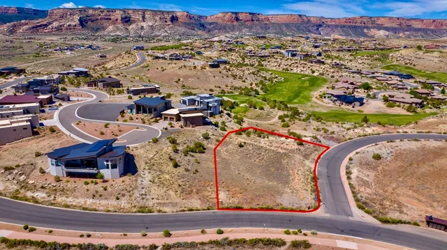 an aerial view of a house with a swimming pool