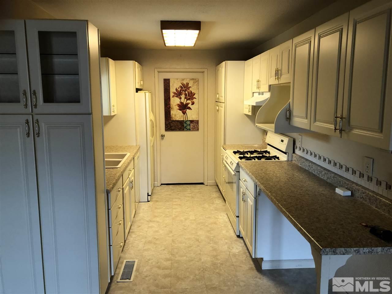 10031 Humite Lane Reno, NV 89506 - Photo 3 of 9 a view of a kitchen from the hallway