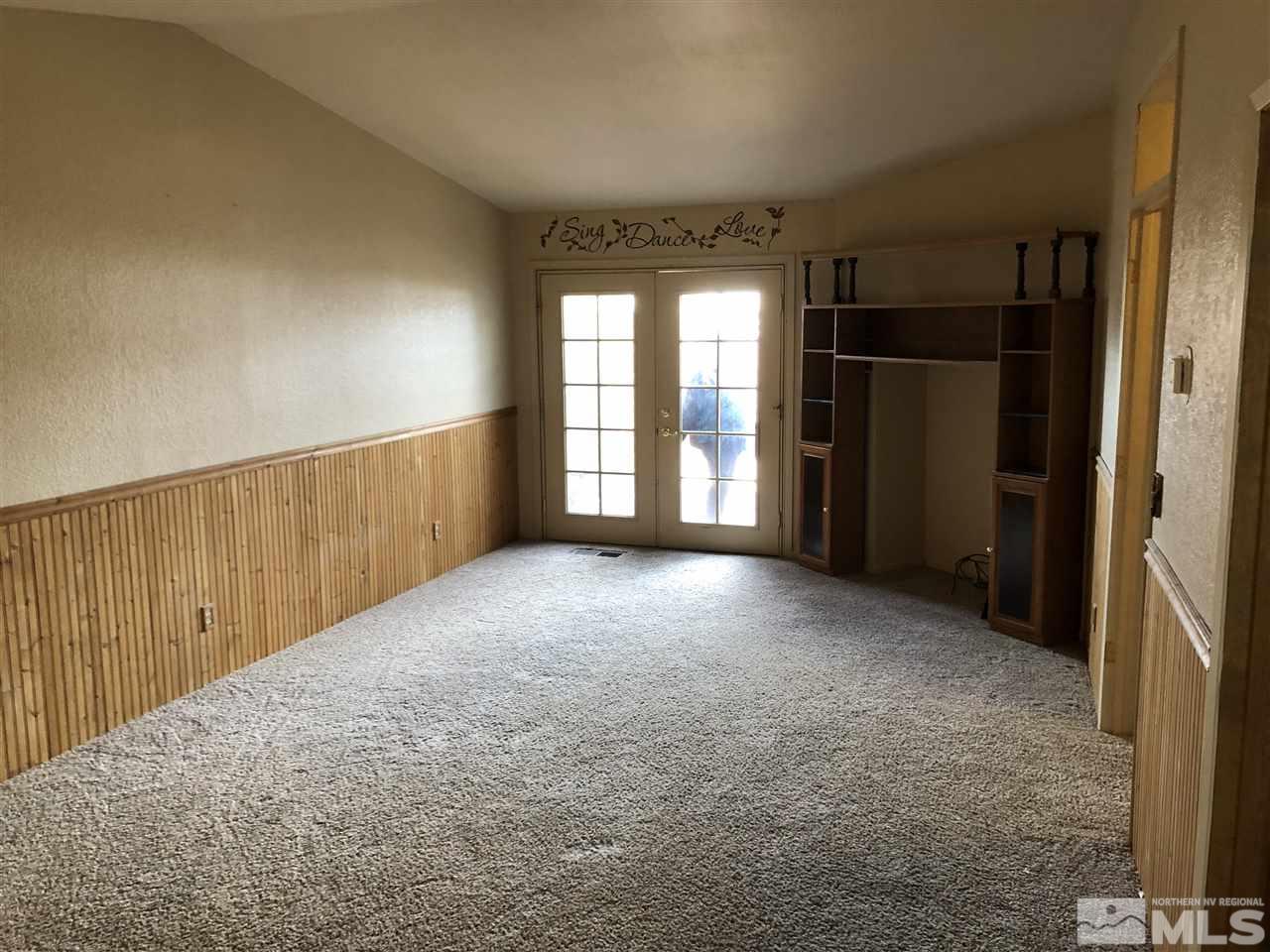 10031 Humite Lane Reno, NV 89506 - Photo 5 of 9 a view of empty room with a fireplace