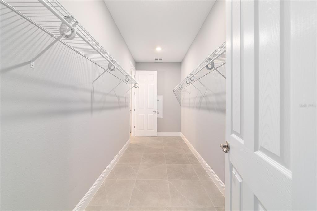 10318 Southwest 96th Loop Ocala, FL 34481 - Photo 43 of 67 a view of a hallway with a white walls