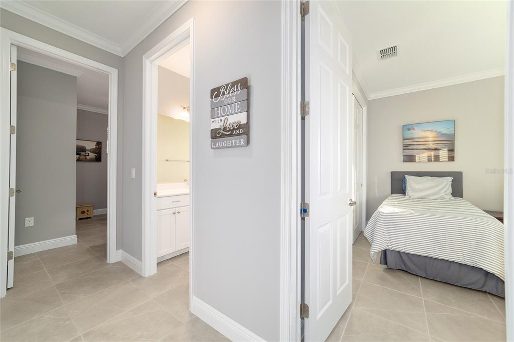 10318 Southwest 96th Loop Ocala, FL 34481 - Photo 44 of 67 a bedroom with a bed and a night stand