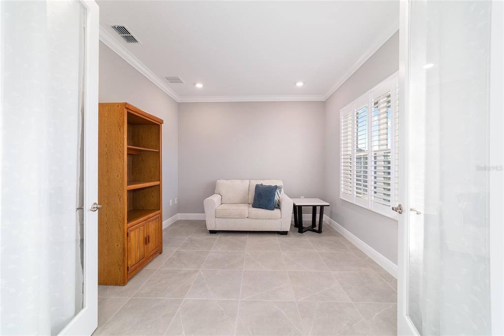 10318 Southwest 96th Loop Ocala, FL 34481 - Photo 51 of 67 a living room with furniture and a window