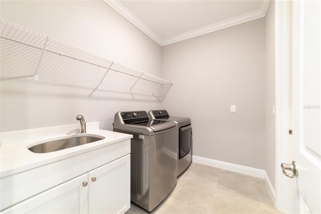 10318 Southwest 96th Loop Ocala, FL 34481 - Photo 55 of 67 a utility room with dryer and washer