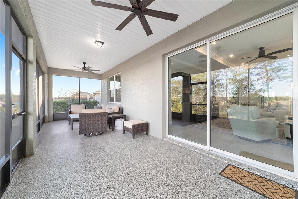 10318 Southwest 96th Loop Ocala, FL 34481 - Photo 60 of 67 a living room with furniture and a large window