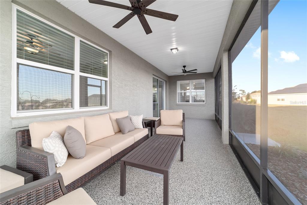 10318 Southwest 96th Loop Ocala, FL 34481 - Photo 61 of 67 a living room with furniture and a large window
