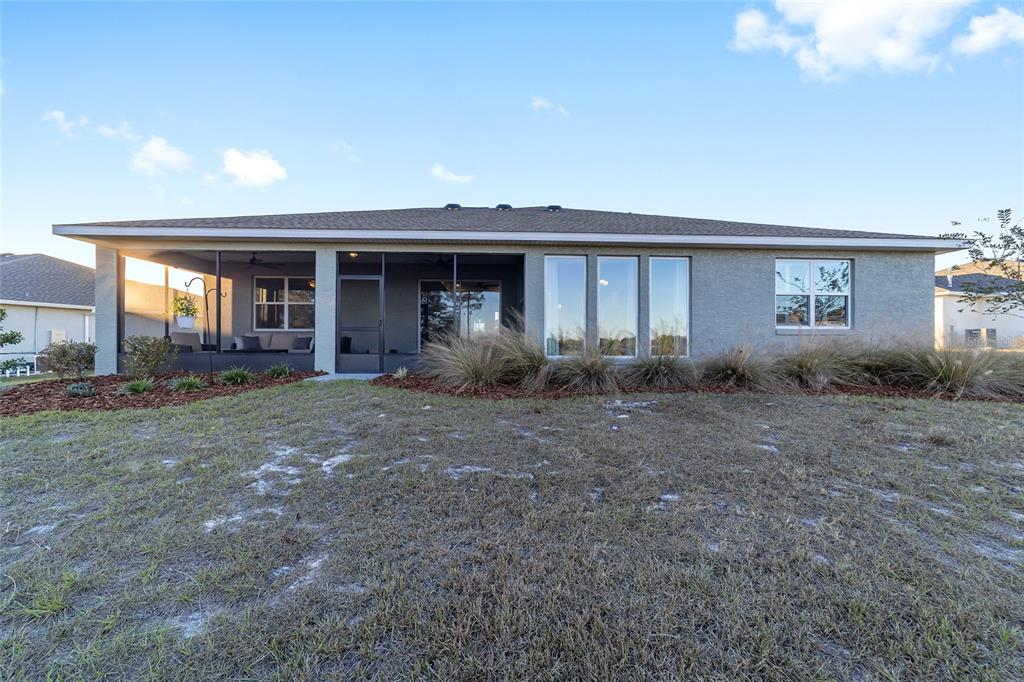 10318 Southwest 96th Loop Ocala, FL 34481 - Photo 64 of 67 a view of a house with backyard and porch