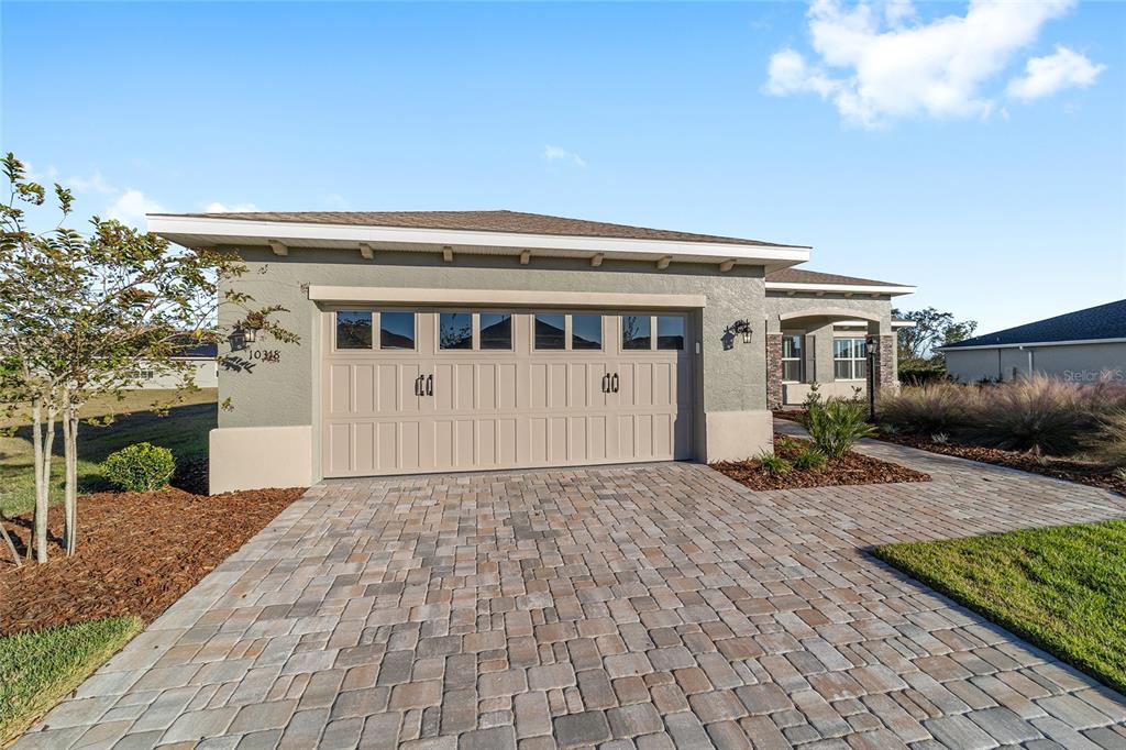 10318 Southwest 96th Loop Ocala, FL 34481 - Photo 7 of 67 a front view of a house with a yard