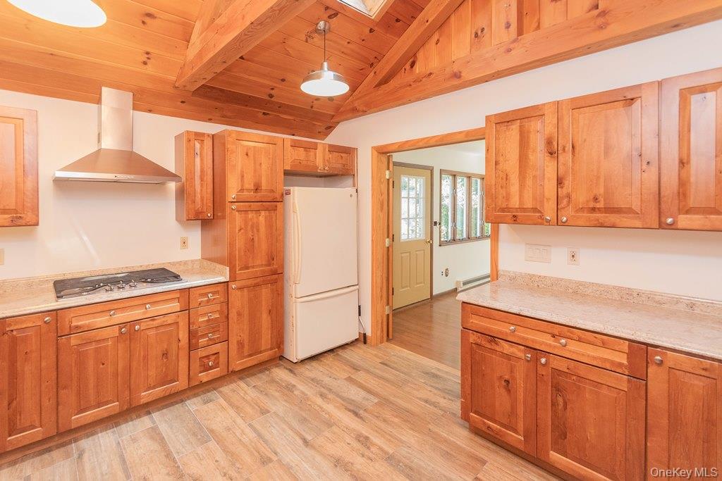 7 Harrimac Lane Putnam Valley, NY 10579 - Photo 11 of 41 a kitchen with stainless steel appliances granite countertop a refrigerator a stove and a wooden floors