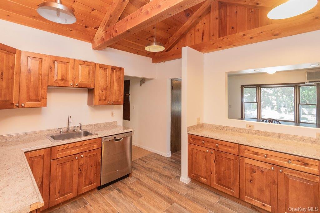 7 Harrimac Lane Putnam Valley, NY 10579 - Photo 14 of 41 a kitchen with a sink and wooden cabinets