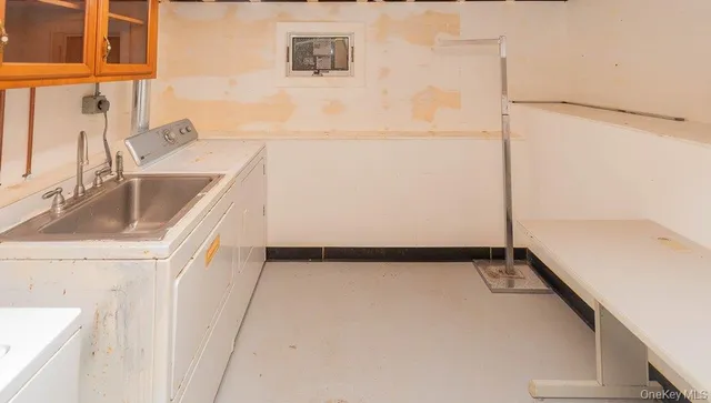 a close up of a sink and a refrigerator
