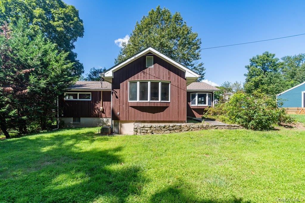 7 Harrimac Lane Putnam Valley, NY 10579 - Photo 29 of 41 a front view of a house with a garden