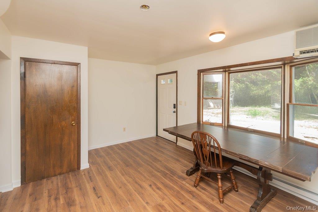 7 Harrimac Lane Putnam Valley, NY 10579 - Photo 3 of 41 a view of room with wooden floor and a window