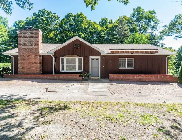 a view of a house with a big yard