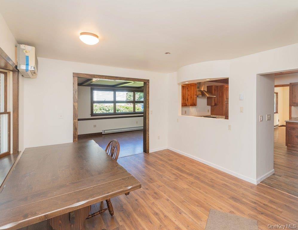 7 Harrimac Lane Putnam Valley, NY 10579 - Photo 5 of 41 a view of an empty room with window and wooden floor