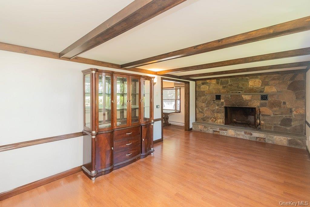7 Harrimac Lane Putnam Valley, NY 10579 - Photo 8 of 41 a view of an empty room with a fireplace and a window