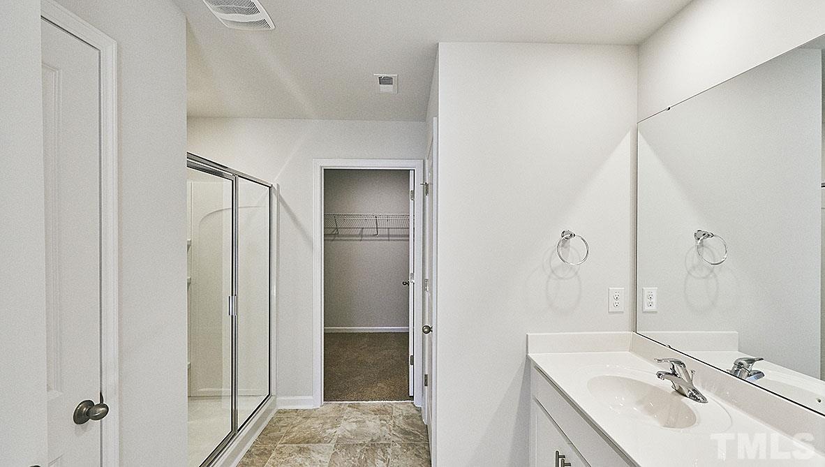 1023 Saddlebrook Drive Rocky Mount, NC 27804 - Photo 25 of 27 a bathroom with a sink and mirror