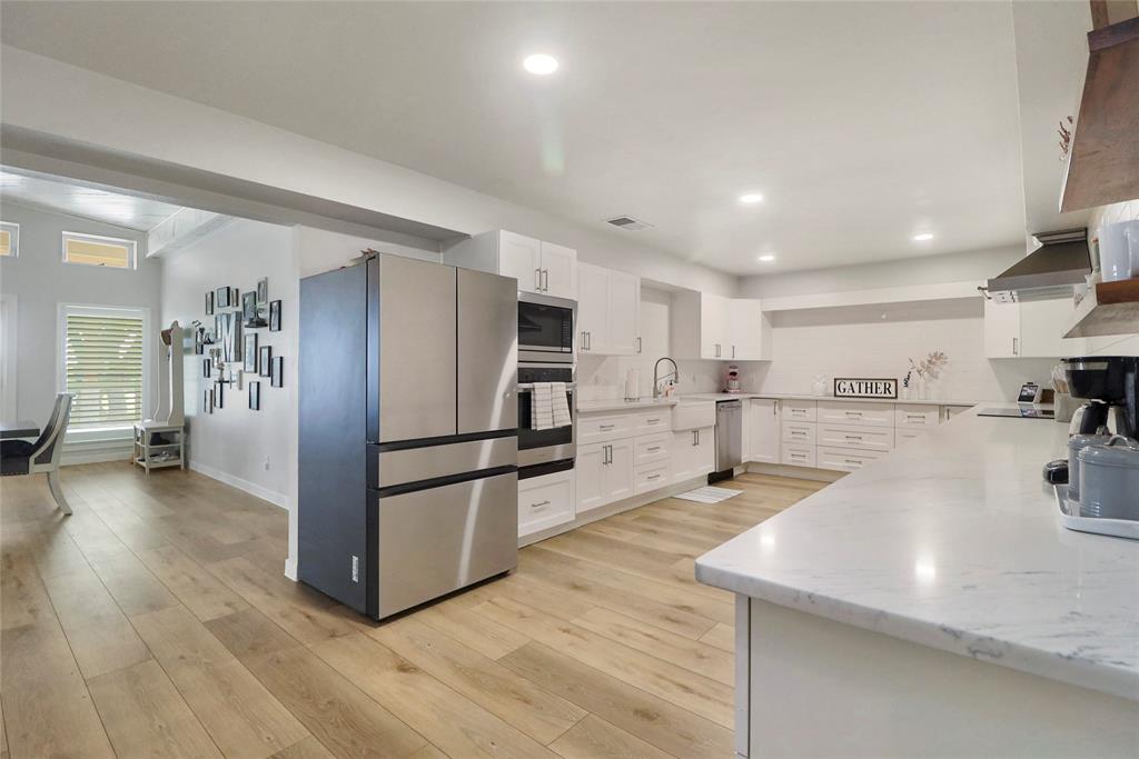2408 Strader Road DISH, TX 76247 - Photo 12 of 40 a kitchen with stainless steel appliances a refrigerator sink and microwave