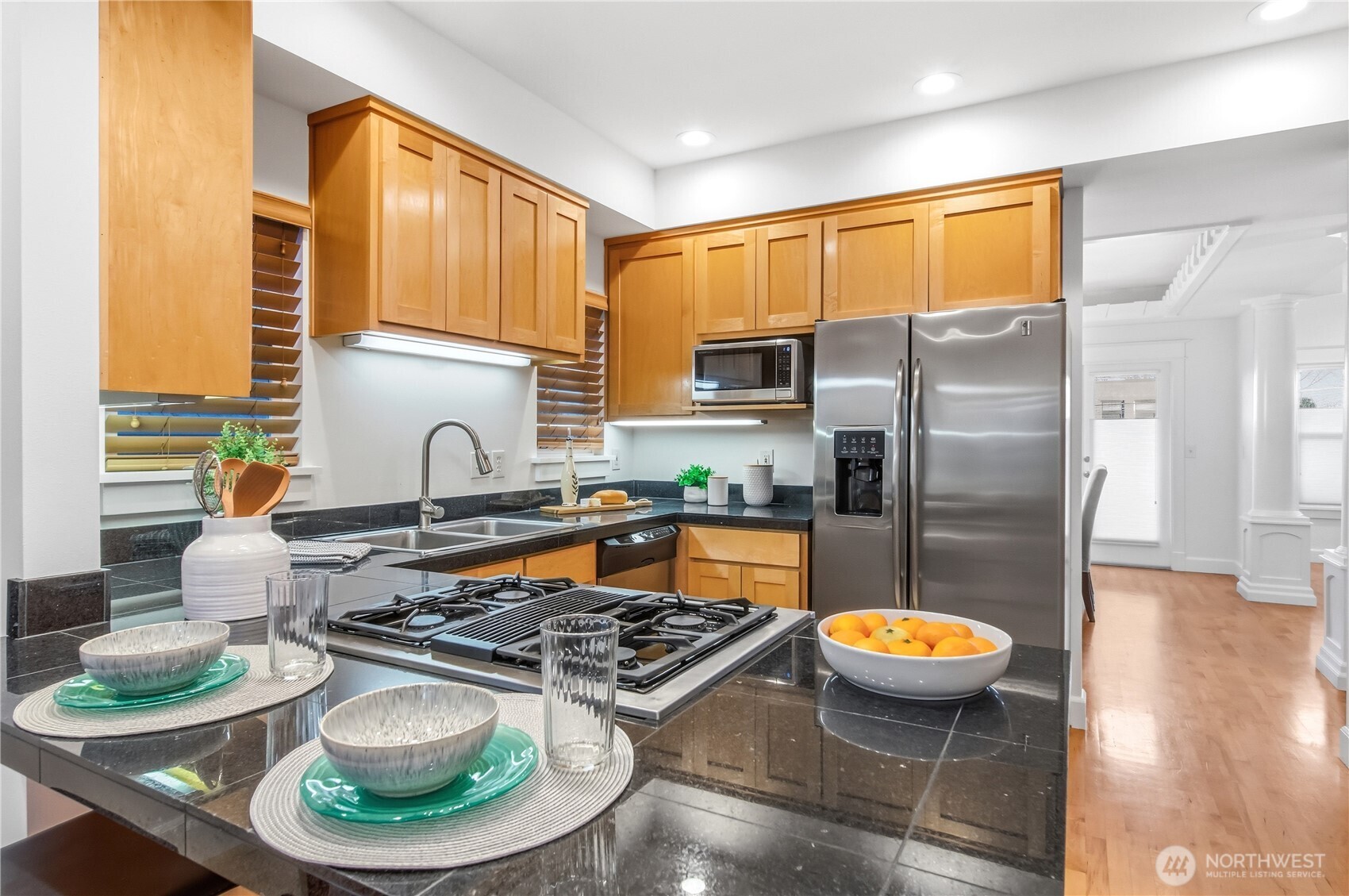 1375 32nd Avenue South Seattle, WA 98144 - Photo 13 of 36 a kitchen with stainless steel appliances a stove a refrigerator and a dining table