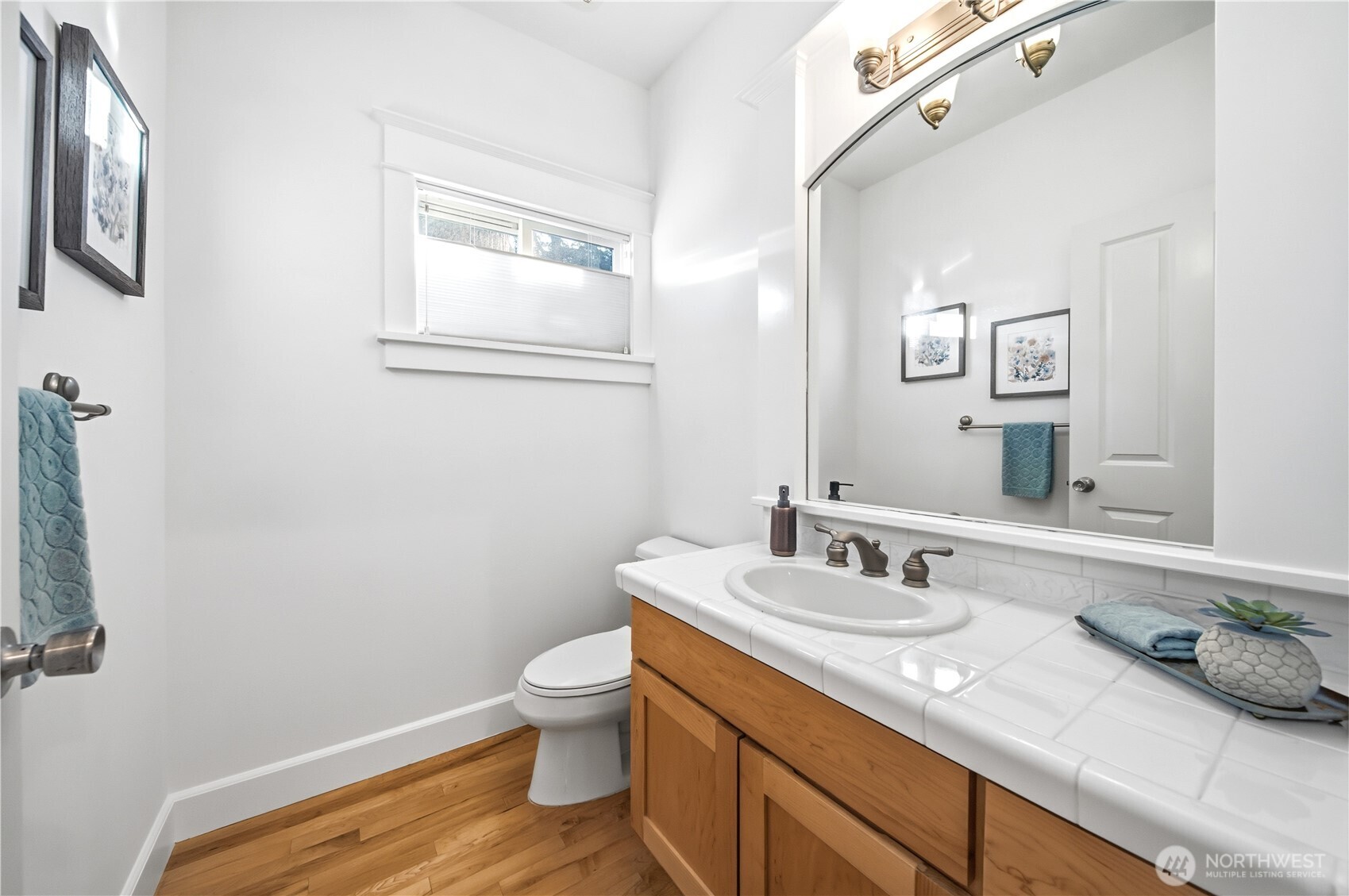 1375 32nd Avenue South Seattle, WA 98144 - Photo 19 of 36 a bathroom with a toilet sink and mirror