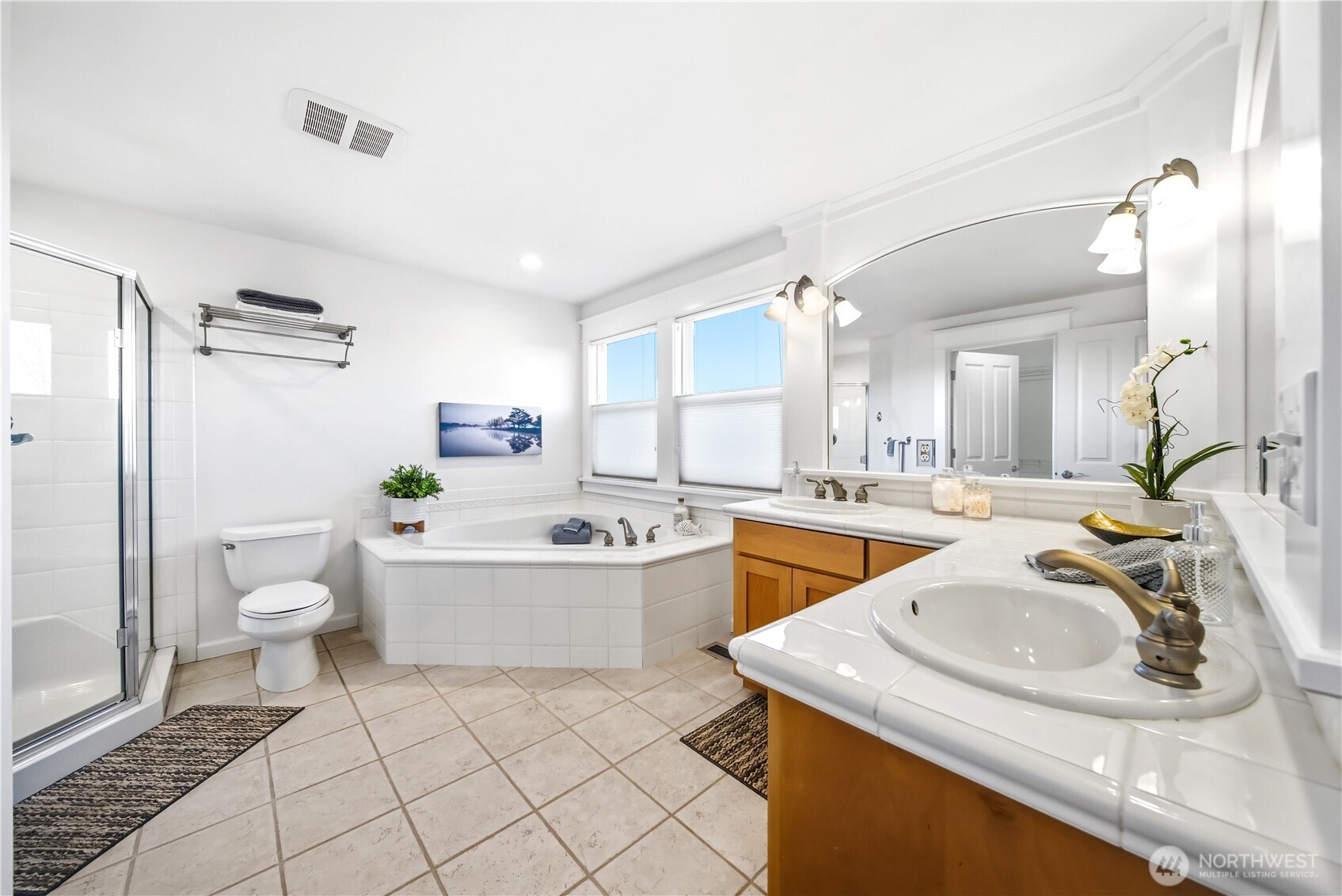 1375 32nd Avenue South Seattle, WA 98144 - Photo 23 of 36 a view of a bathroom with a sink and mirror with toilet