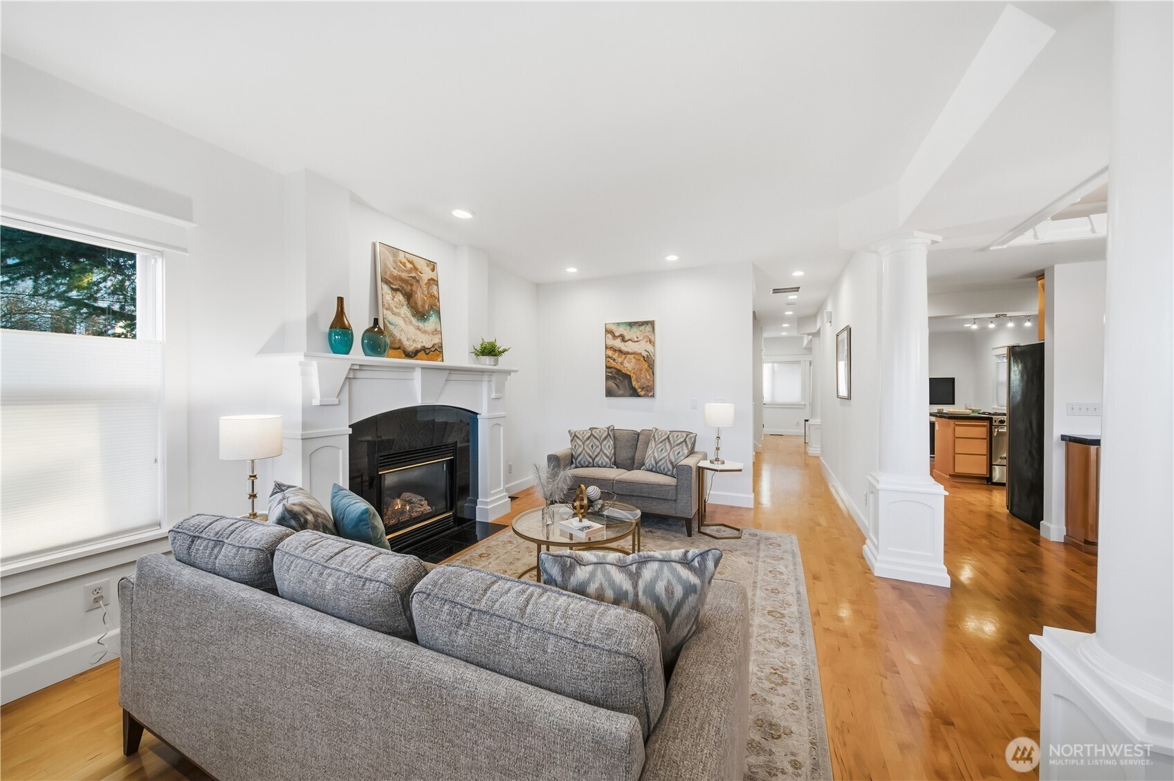 1375 32nd Avenue South Seattle, WA 98144 - Photo 7 of 36 a living room with furniture a fireplace and a large window