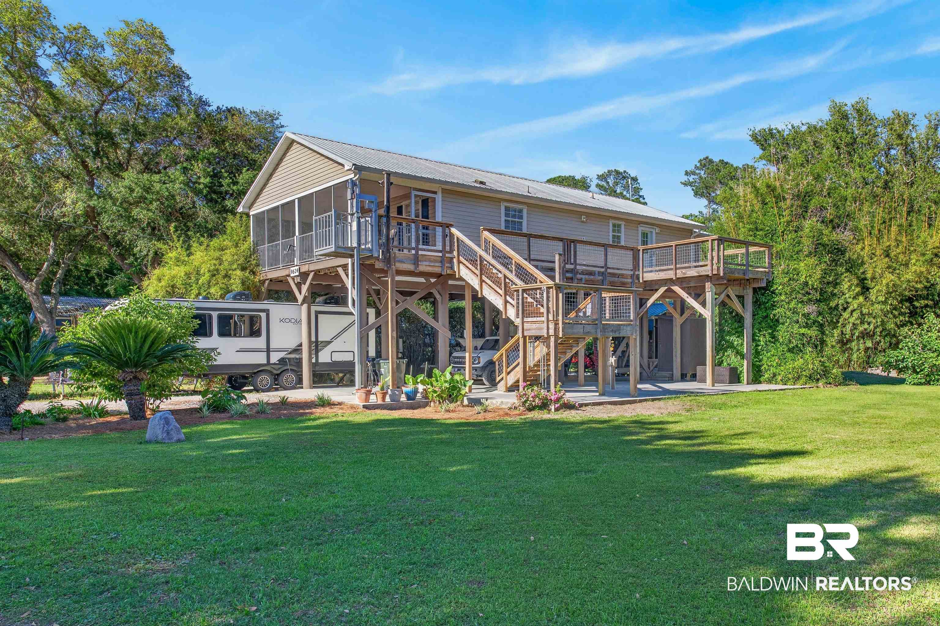 9624 North Bay Street Foley, AL 36535 - Photo 42 of 59 Elevated residence featuring neutral siding and a metal roof