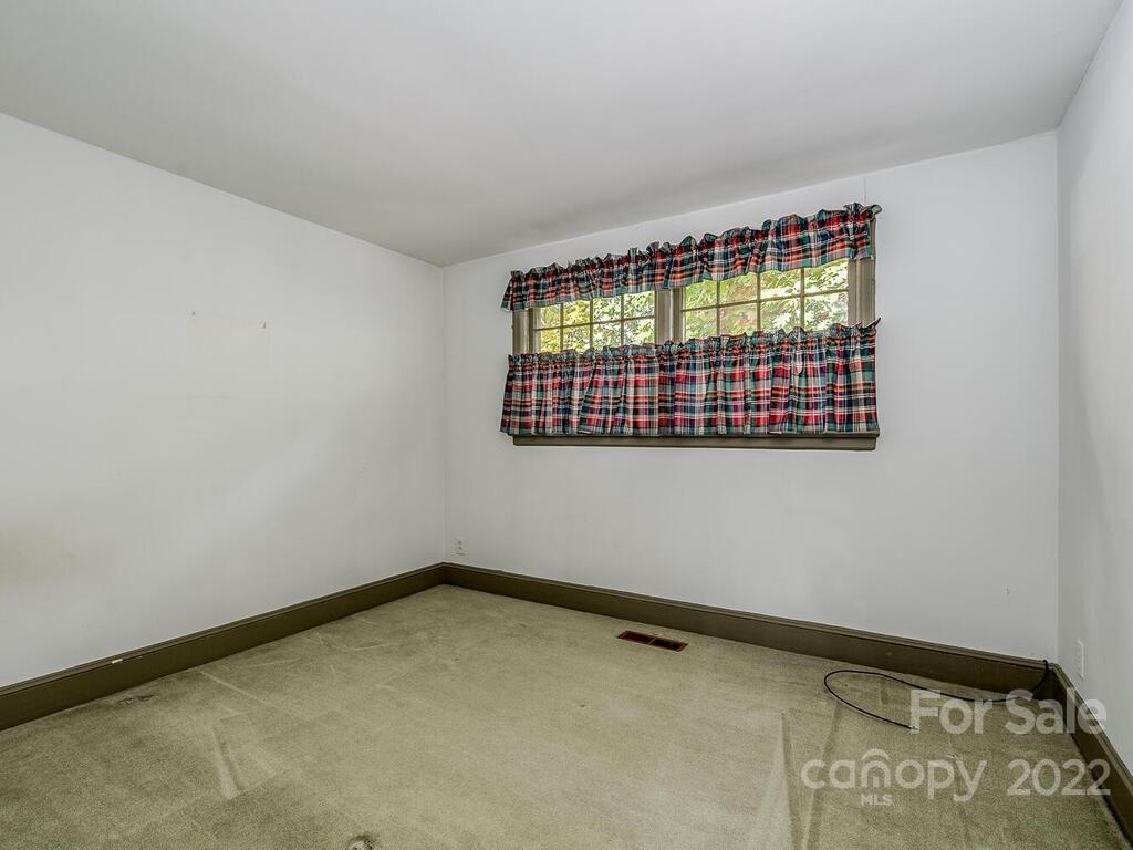 627 Sandridge Road Charlotte, NC 28210 - Photo 14 of 19 a view of an empty room with a window