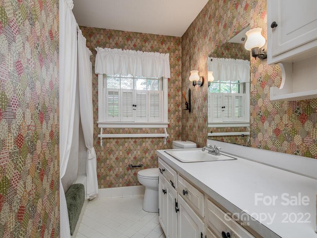 627 Sandridge Road Charlotte, NC 28210 - Photo 9 of 19 a bathroom with a granite countertop sink a toilet and shower