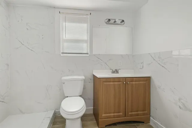 a bathroom with a toilet and a sink