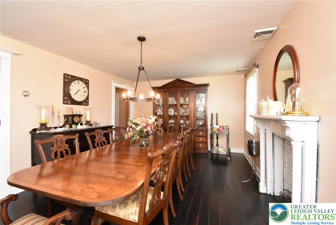 424 Grape Street Whitehall, PA 18052 - Photo 27 of 56 This formal dining room features dark wood floors, and a charming chandelier.