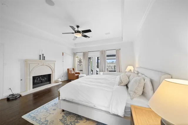 a spacious bedroom with a bed and a fireplace