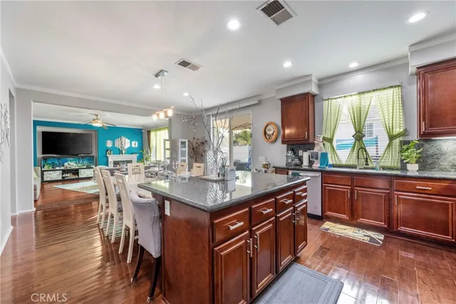 a living room with furniture flat screen tv and a fireplace