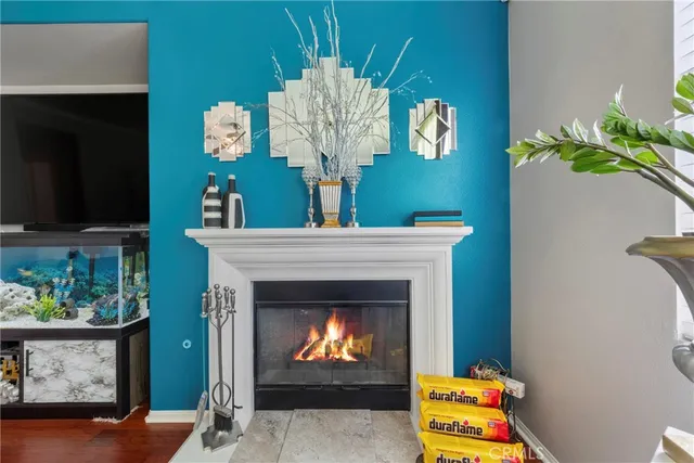 a living room with furniture and a ceiling fan