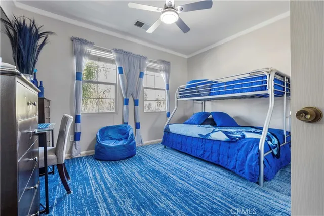 a living room filled with furniture and a flat screen tv