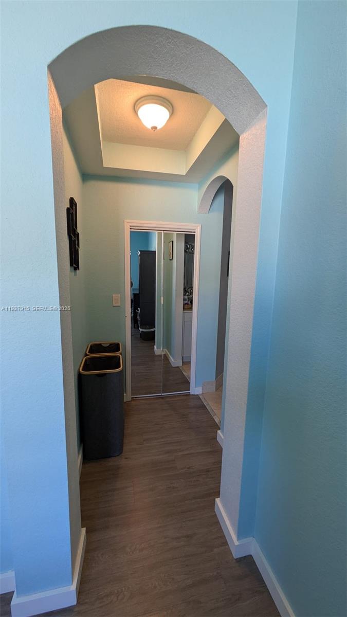 12293 Southwest 123rd Terrace Miami, FL 33186 - Photo 20 of 30 a view of a hallway with wooden floor