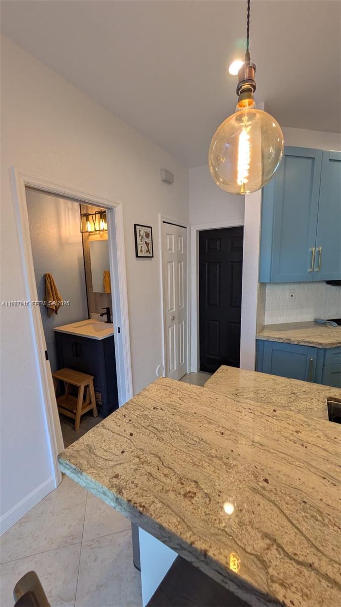 12293 Southwest 123rd Terrace Miami, FL 33186 - Photo 22 of 30 a bedroom with a bed and a mirror