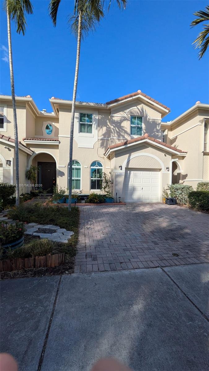 12293 Southwest 123rd Terrace Miami, FL 33186 - Photo 27 of 30 a view of a white house with a yard