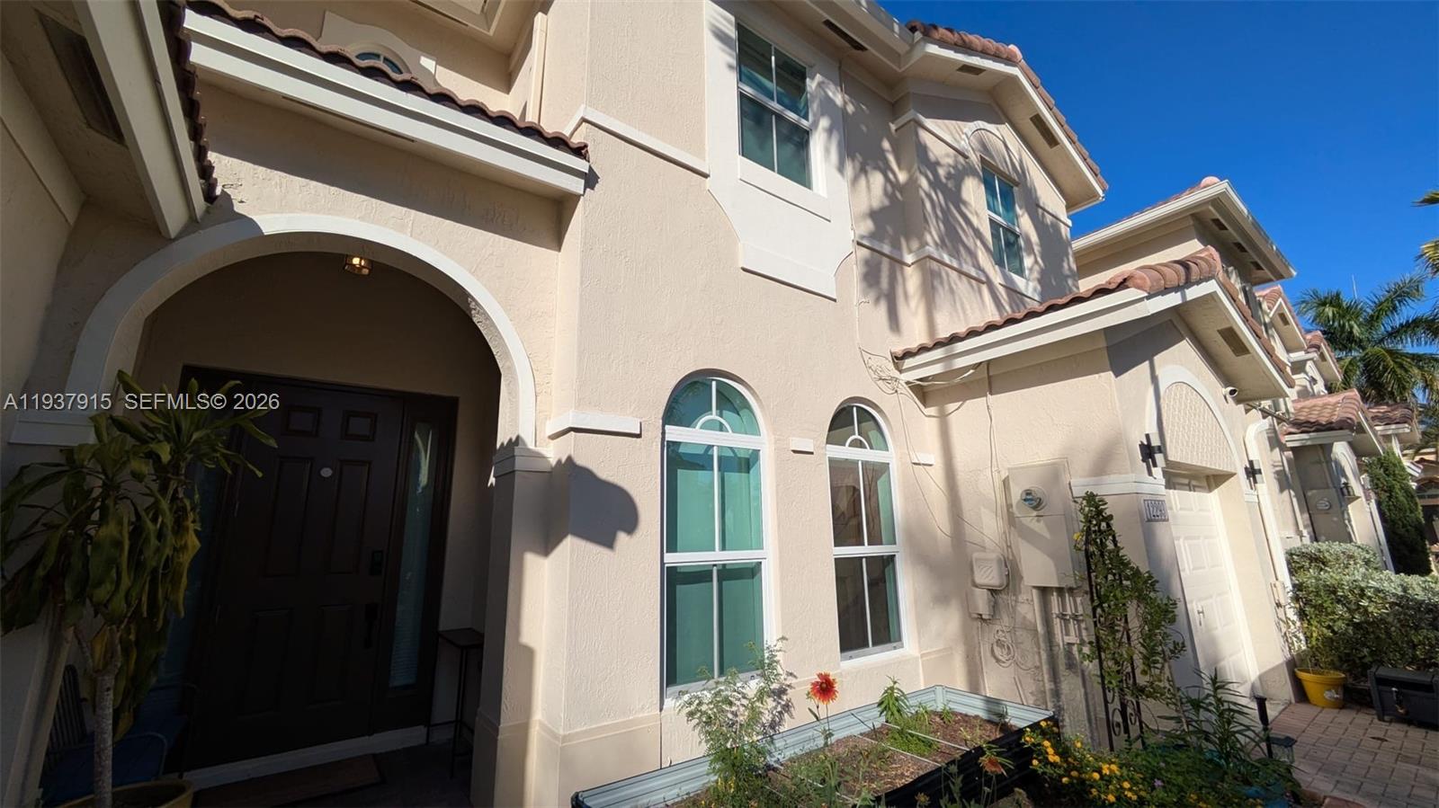 12293 Southwest 123rd Terrace Miami, FL 33186 - Photo 28 of 30 a view of front door and small yard