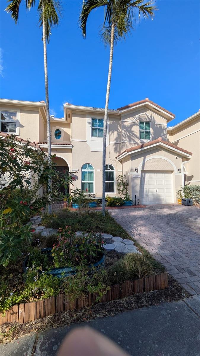 12293 Southwest 123rd Terrace Miami, FL 33186 - Photo 29 of 30 a front view of a house with garden