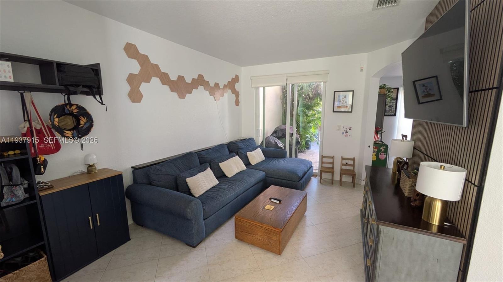 12293 Southwest 123rd Terrace Miami, FL 33186 - Photo 3 of 30 a living room with furniture and wooden floor