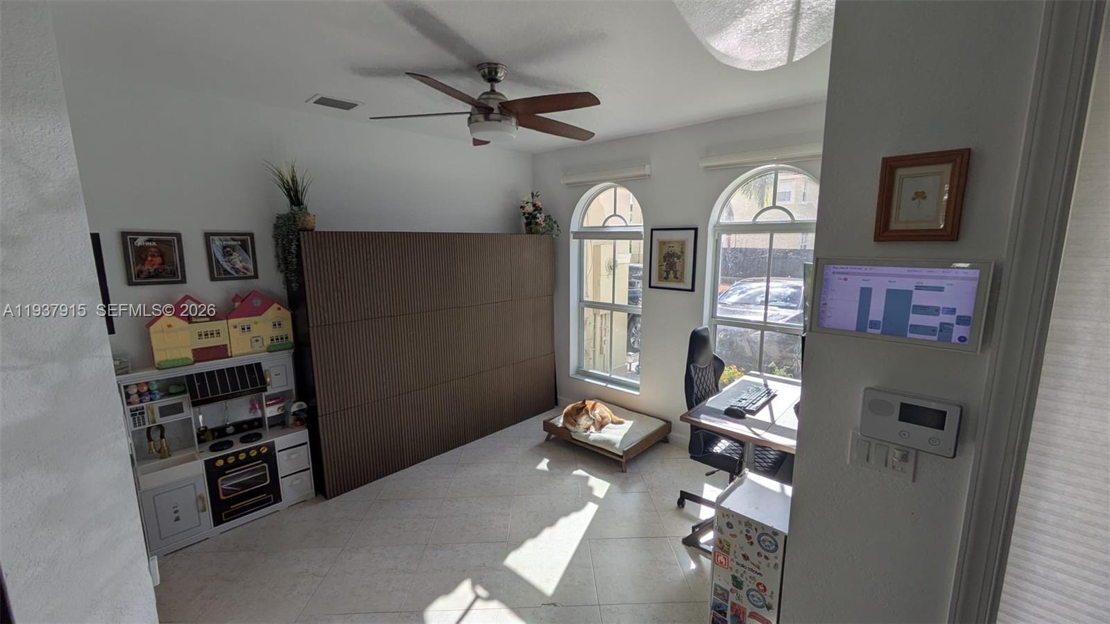 12293 Southwest 123rd Terrace Miami, FL 33186 - Photo 5 of 30 a view of a livingroom with furniture and toys