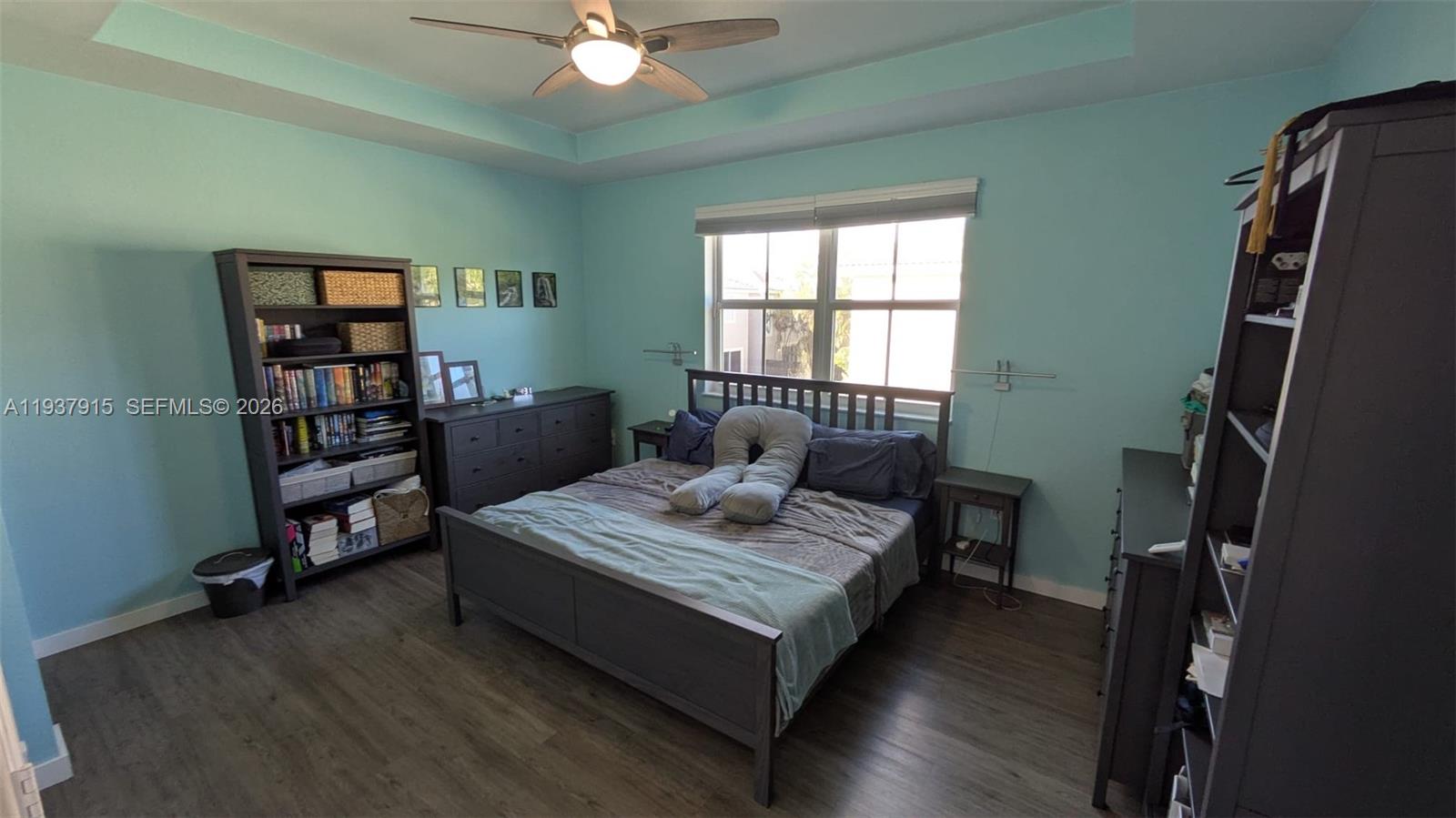 12293 Southwest 123rd Terrace Miami, FL 33186 - Photo 9 of 30 a bedroom with a bed furniture and a window