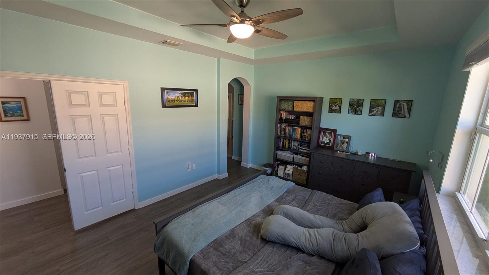 12293 Southwest 123rd Terrace Miami, FL 33186 - Photo 10 of 30 a bedroom with furniture and a window