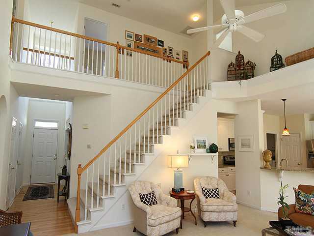 12308 Amoretto Way Raleigh, NC 27613 - Photo 3 of 13 Another view of the family room with a view of the 2-story entry foyer and stairway.