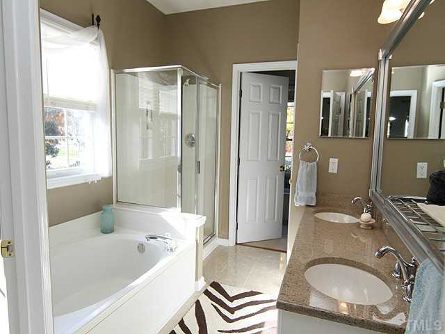 12308 Amoretto Way Raleigh, NC 27613 - Photo 9 of 13 Master bath was recently renovated with new granite and tile.