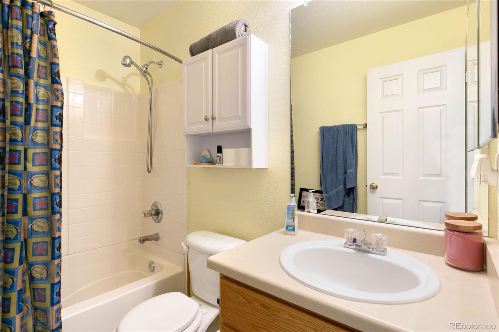 1606 Conestoga Drive Fort Lupton, CO 80621 - Photo 17 of 25 a bathroom with a sink toilet and shower