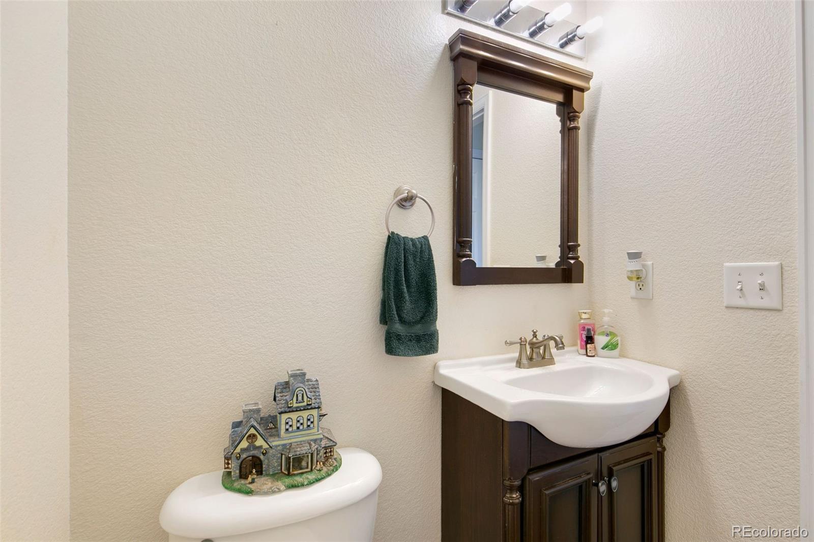 1606 Conestoga Drive Fort Lupton, CO 80621 - Photo 18 of 25 a bathroom with a sink vanity and a mirror