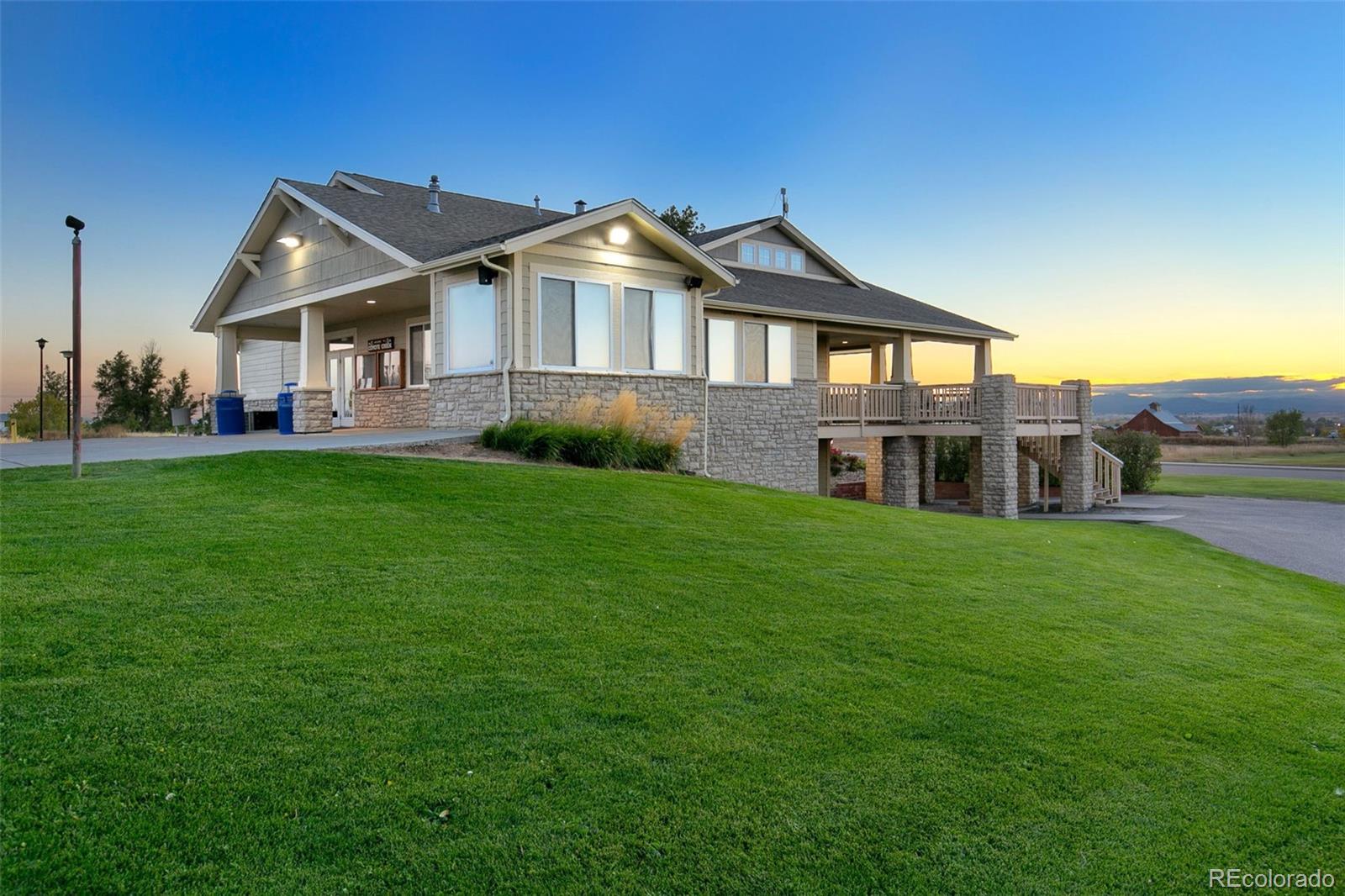 1606 Conestoga Drive Fort Lupton, CO 80621 - Photo 24 of 25 a front view of a house with a garden